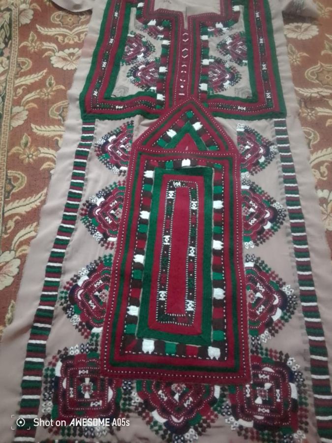 Beige Balochi dress front with maroon and green embroidery