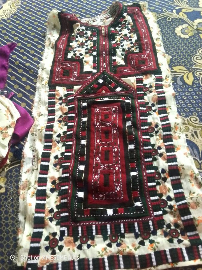 Cream floral fabric with maroon Balochi embroidery