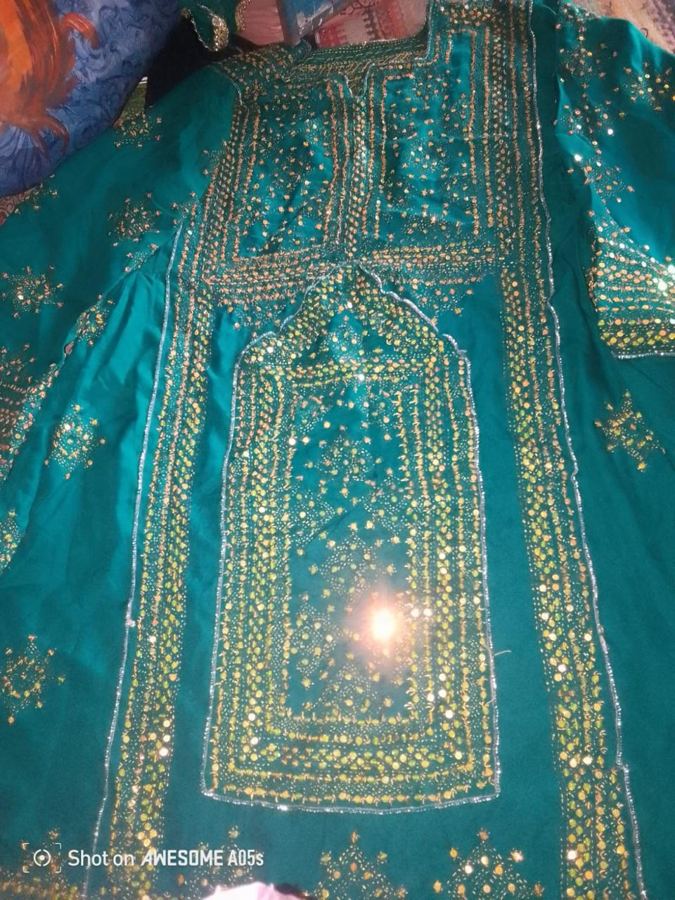Green Balochi wedding dress with gold sequin work