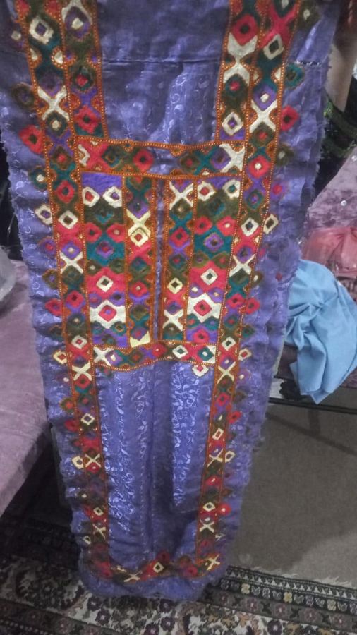 Lilac Balochi dress front with colourful geometric kundi embroidery