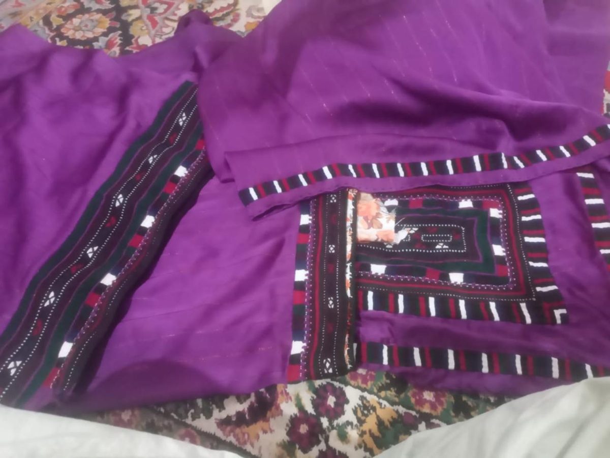 Purple Balochi dress with embroidered front pocket and borders